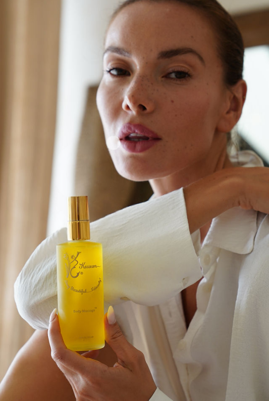 person holding luxury natural body massage oil