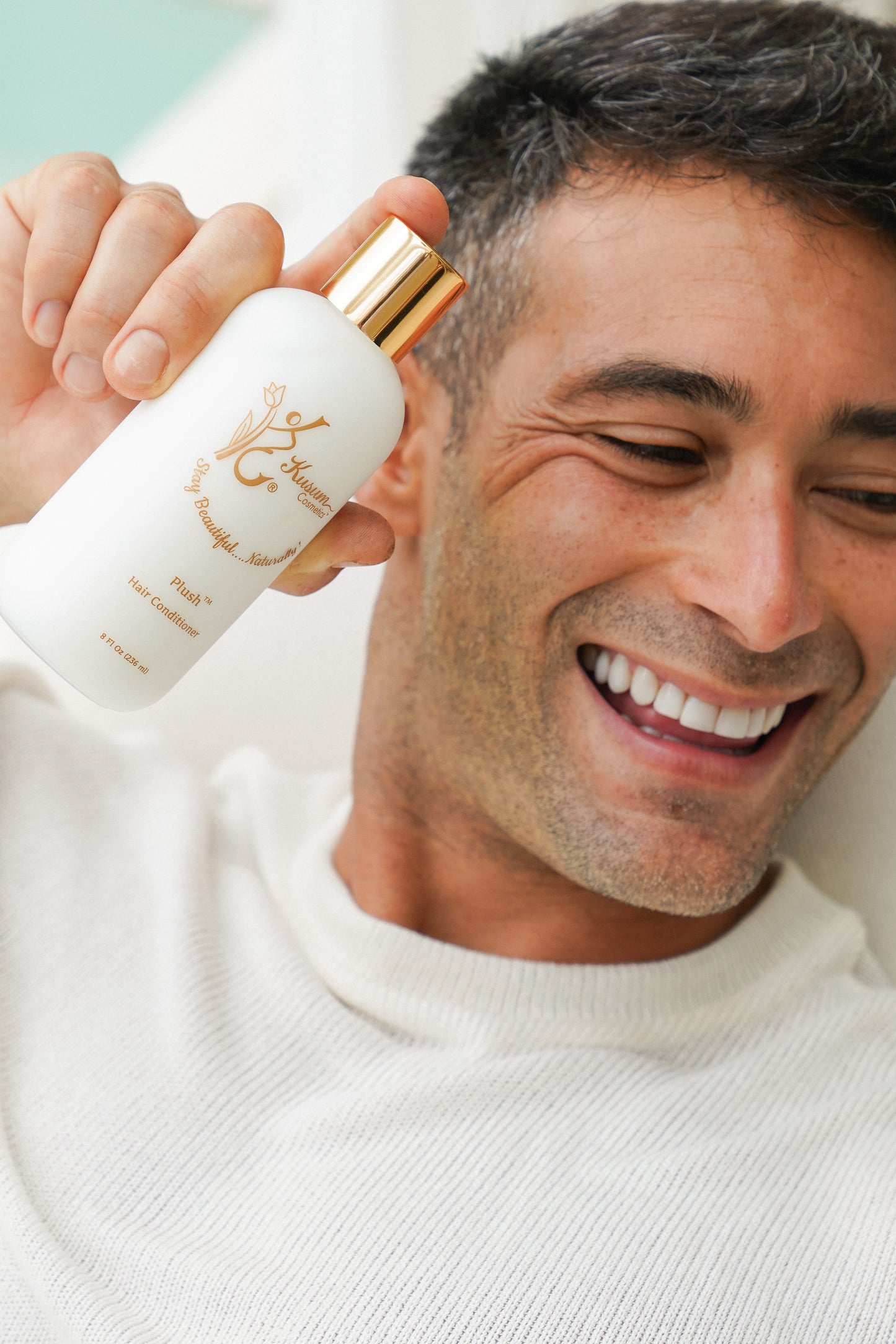 person holding luxury natural hair conditioner