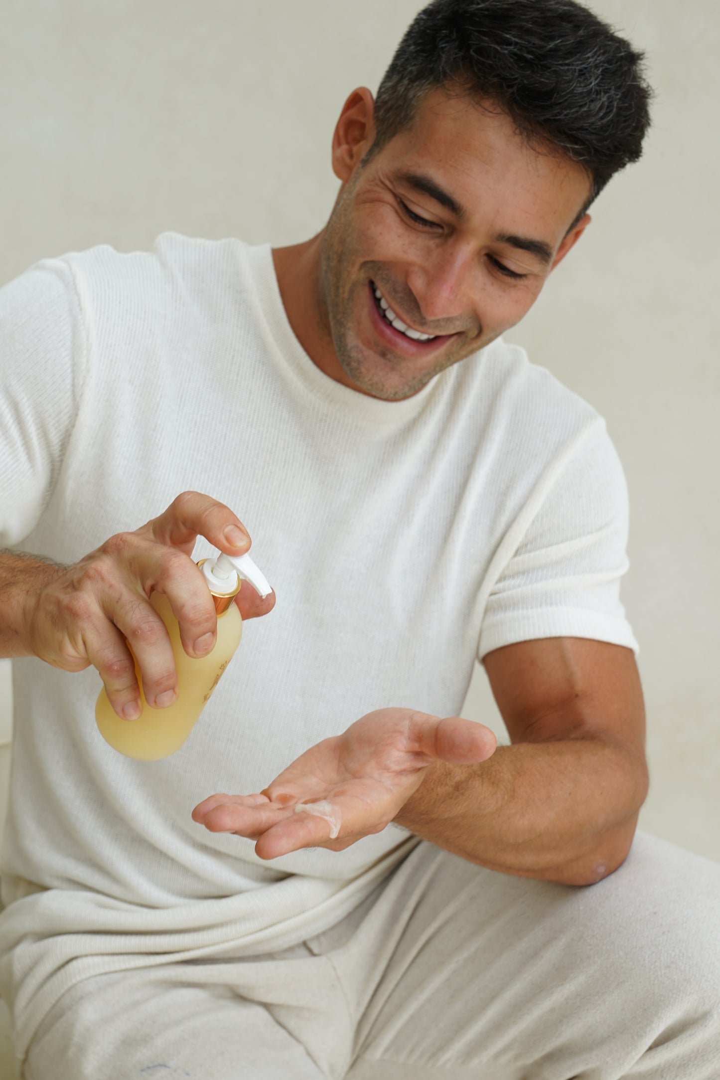 person using luxury natural hair shampoo
