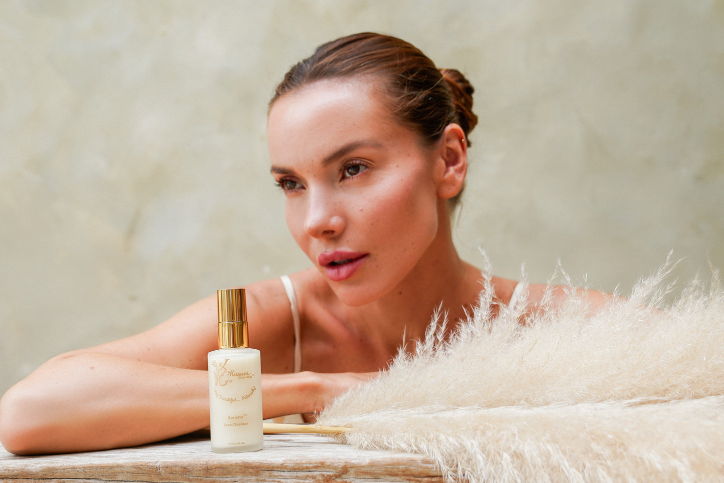 person with luxury natural skincare cleanser