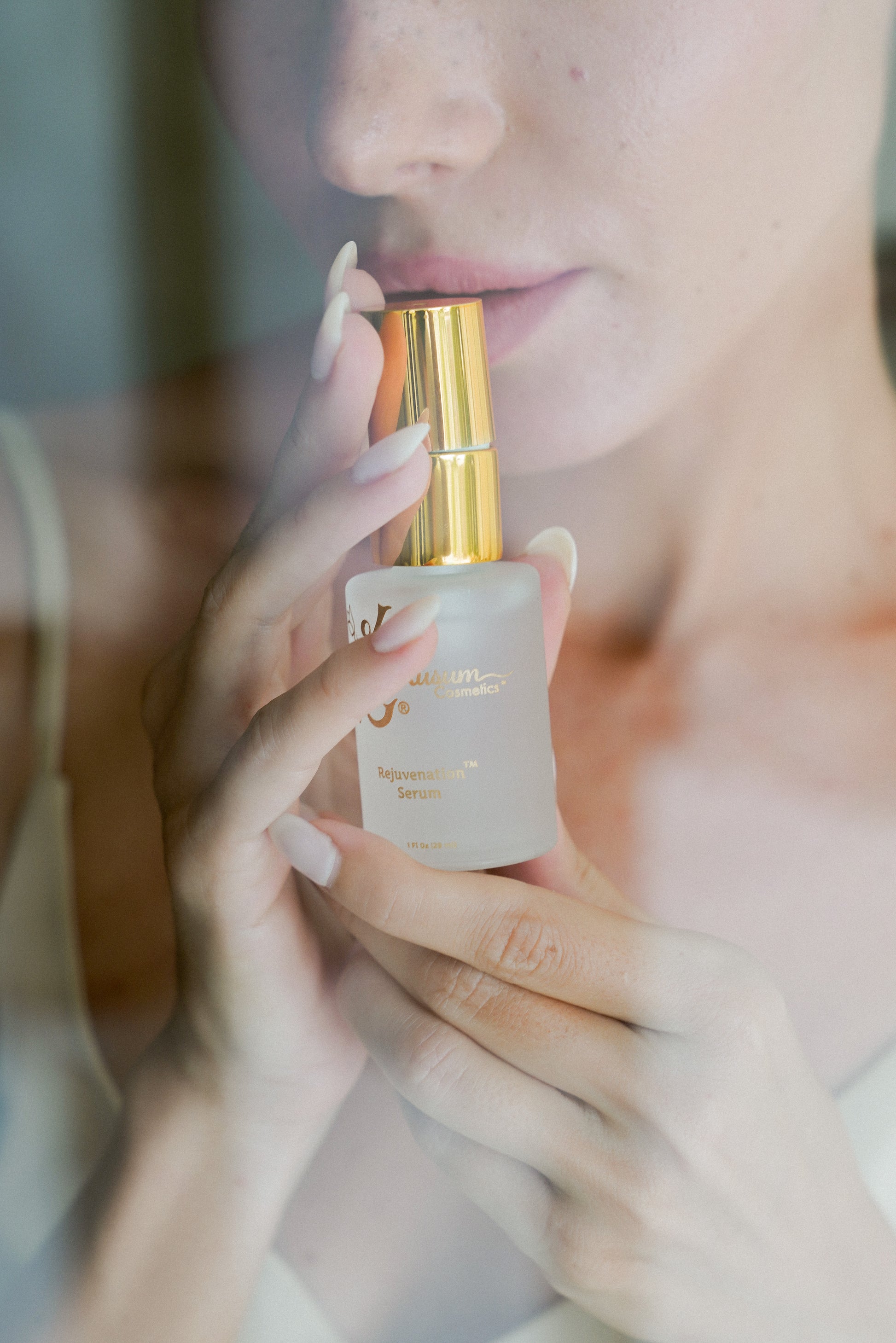 person holding luxury natural skincare face serum